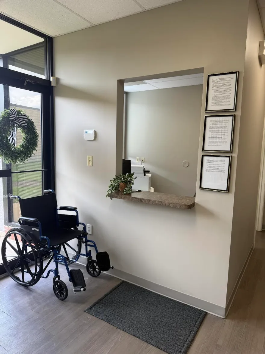 The check-in window, with a wheelchair available beside an accessible entrance